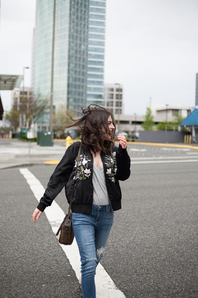 Embroidered bomber jacket, frayed hem jeans, studded mules