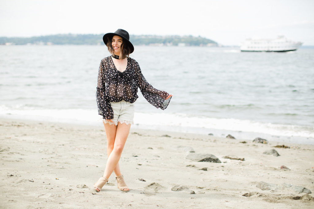 Black cut out floral blouse with black felt panama hat, denim shorts with lace trim (1)