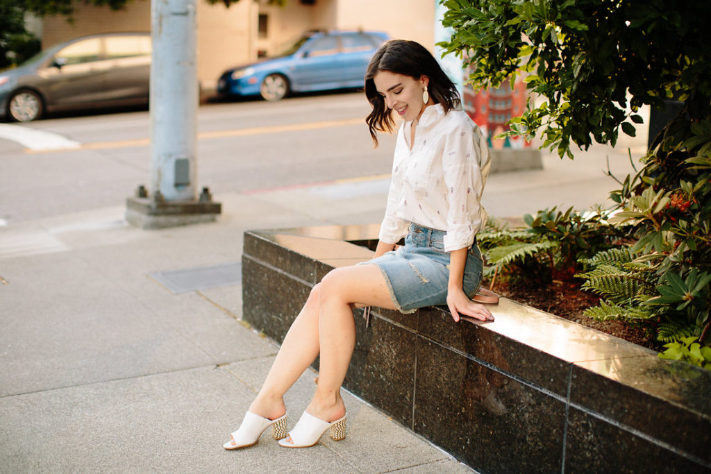 Denim skirt with cactus blouse and white mules