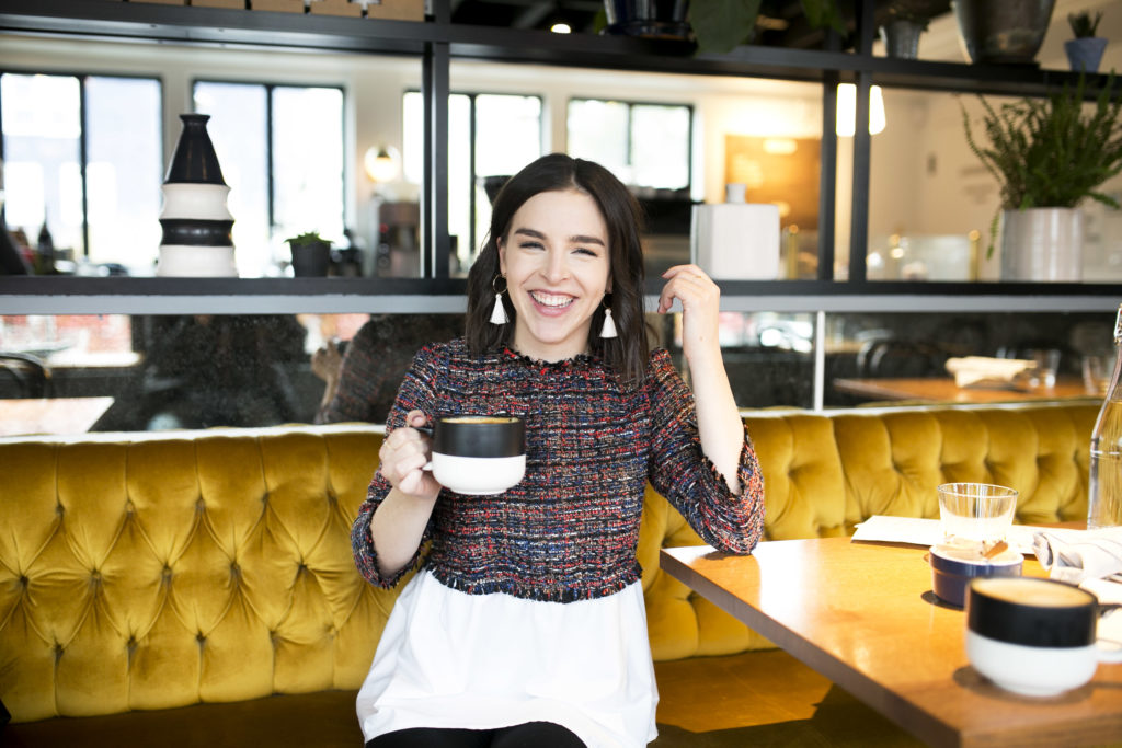 White fringe earrings and tweed blouse