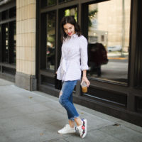 Striped collared button up blouse and embroidered white sneakers