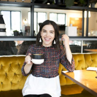 White fringe earrings and tweed blouse